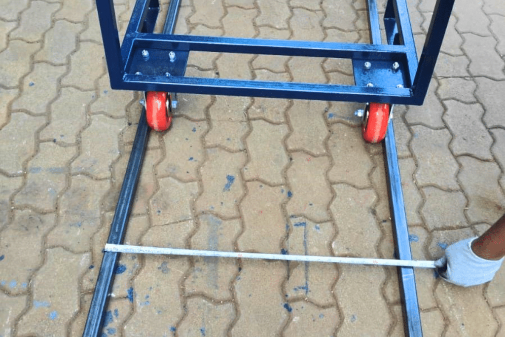 Automotive component manufacturing facility using industrial material-handling trolleys