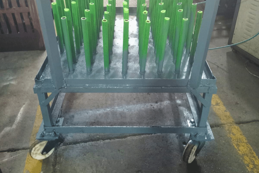 Heavy-industry material-handling trolley operating on a rough forging shop floor